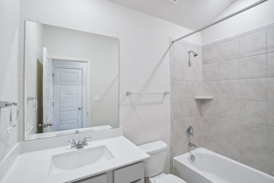 Guest bedroom in the Callaghan floorplan at a Meritage Homes community.