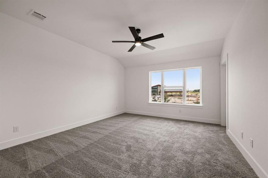 This dreamy owner's bedroom offers plenty of space and natural light.