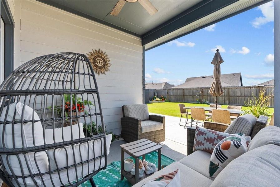 Enjoy the covered back patio overlooking the nice-sized backyard with plenty of space to relax, play, or entertain.