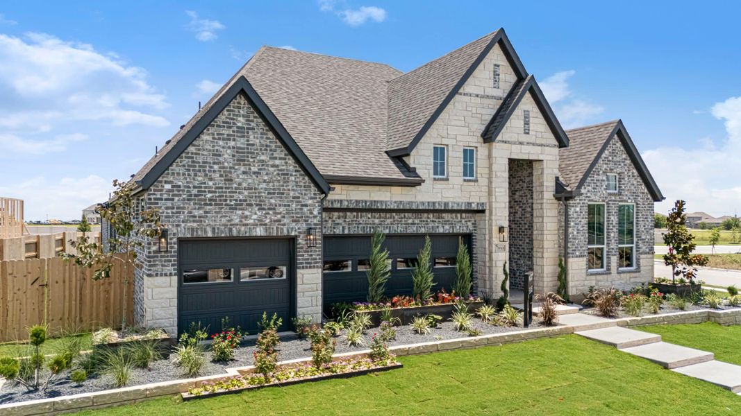 Front exterior of a new home in The Grove at Blackhawk, Pflugerville, TX, highlighting curb appeal (Image 29). Front exterior of a new home in The Grove at Blackhawk, Pflugerville, TX, highlighting curb appeal (Image 29).
