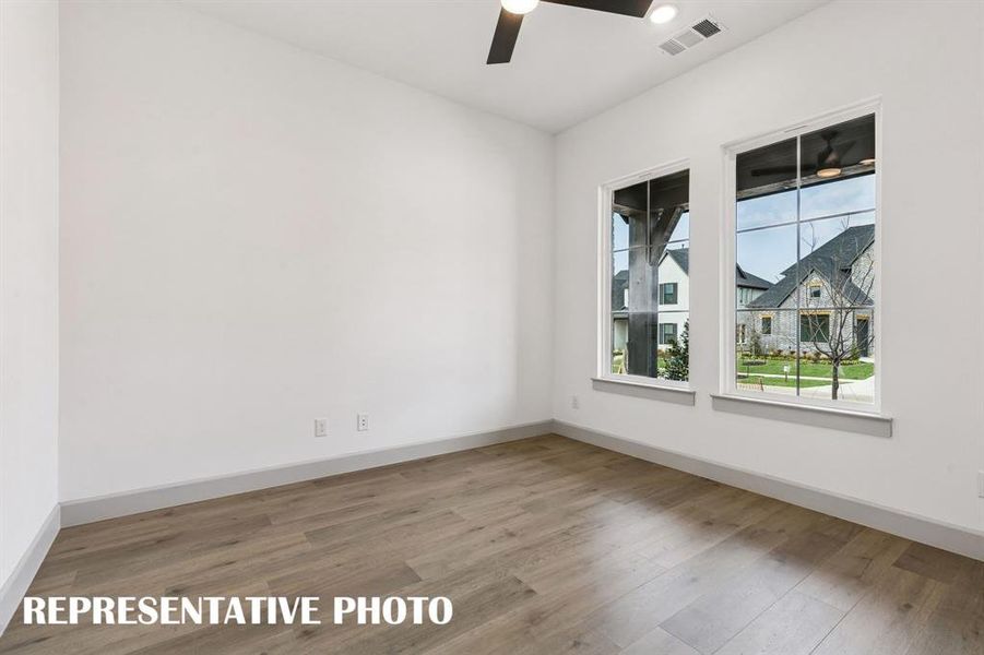 The professional working from home will appreciate this private, light filled home office.  REPRESENTATIVE PHOTO