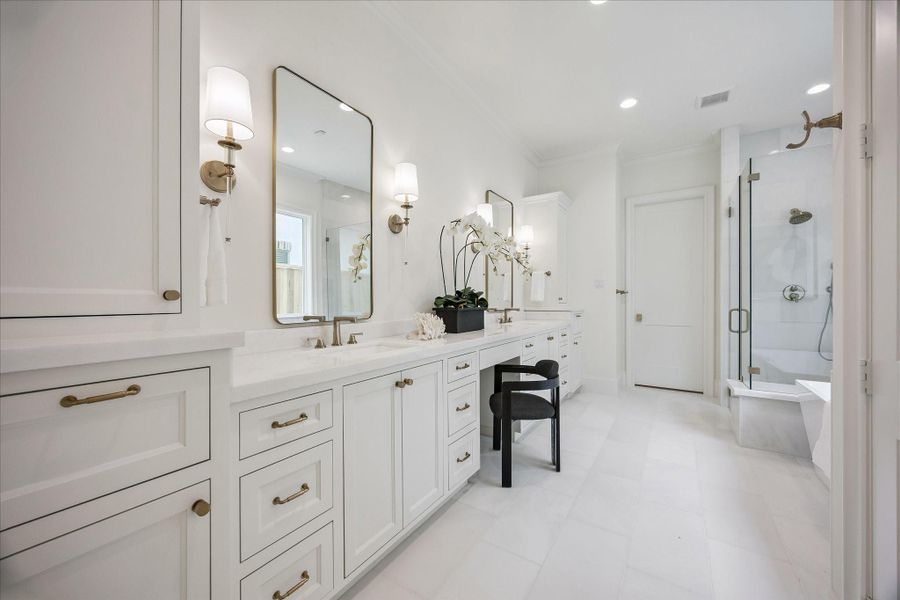 Spa-like primary bath with stand alone soaking tub and frameless glass, dual headed shower