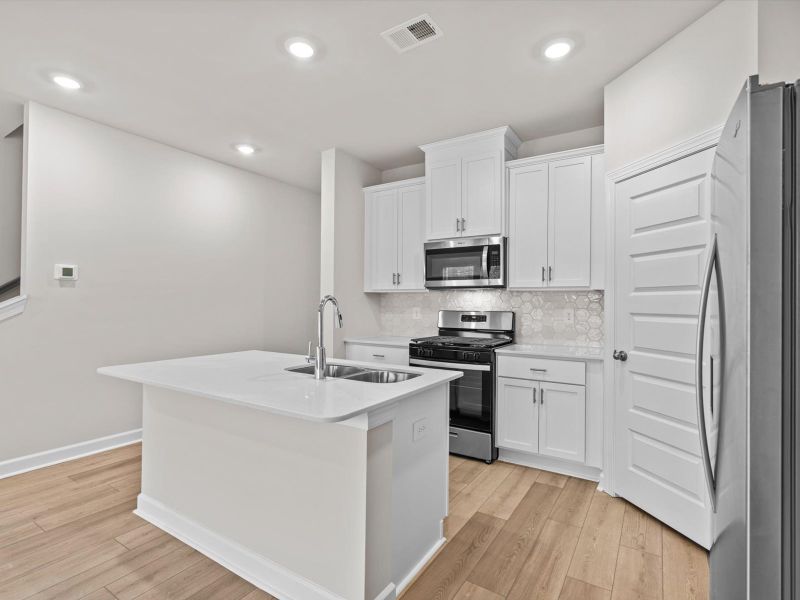 Furnished interior view inside a new home in Crossing at Abner Creek Townes, Greer (Image 5).