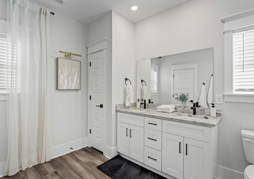 The master bathroom includes a lot of storage.