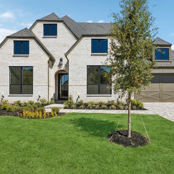 Front exterior of a new home in StarView, Prosper, TX, highlighting curb appeal (Image 27).