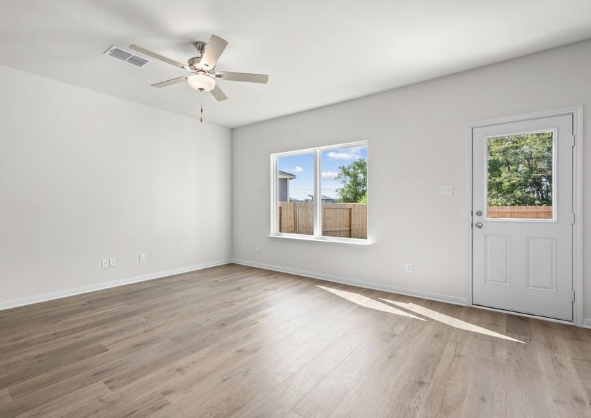 The living room has a large window that lets in great, natural light.