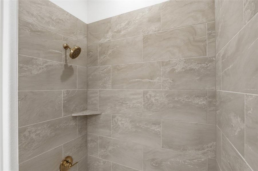 Bathroom view of a tile shower