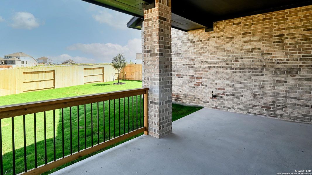 Exterior details and patio area of a home in Homestead 55', Schertz (Image 3).
