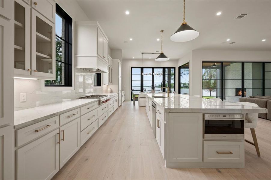 Kitchen with a sink, plenty of natural light, recessed lighting, appliances with stainless steel finishes, and decorative backsplash Kitchen with a sink, plenty of natural light, recessed lighting, appliances with stainless steel finishes, and decorative backsplash