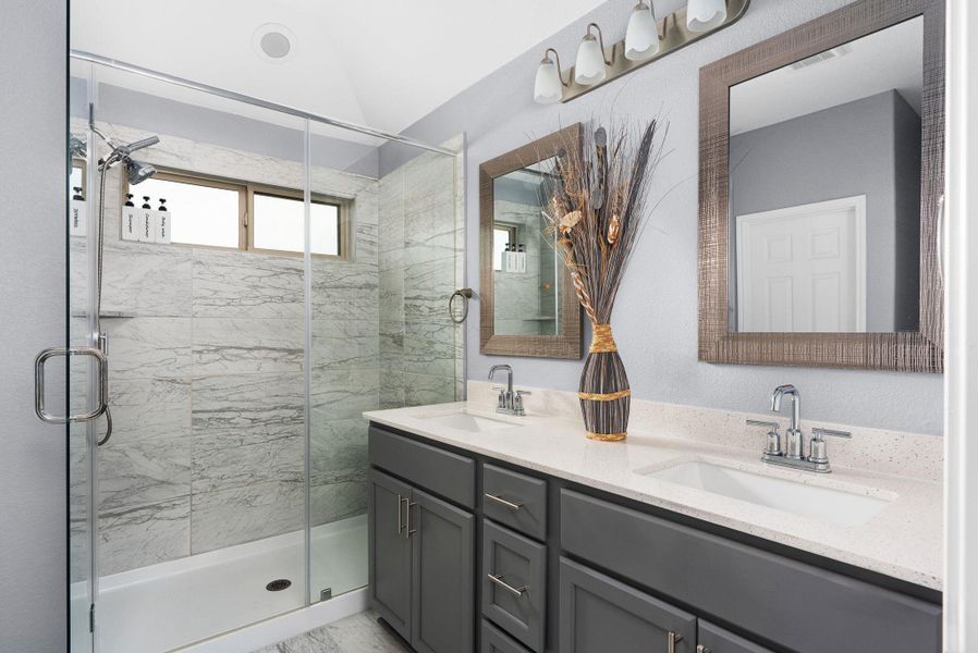 Primary bathroom with dual vanities. Primary bathroom with dual vanities.