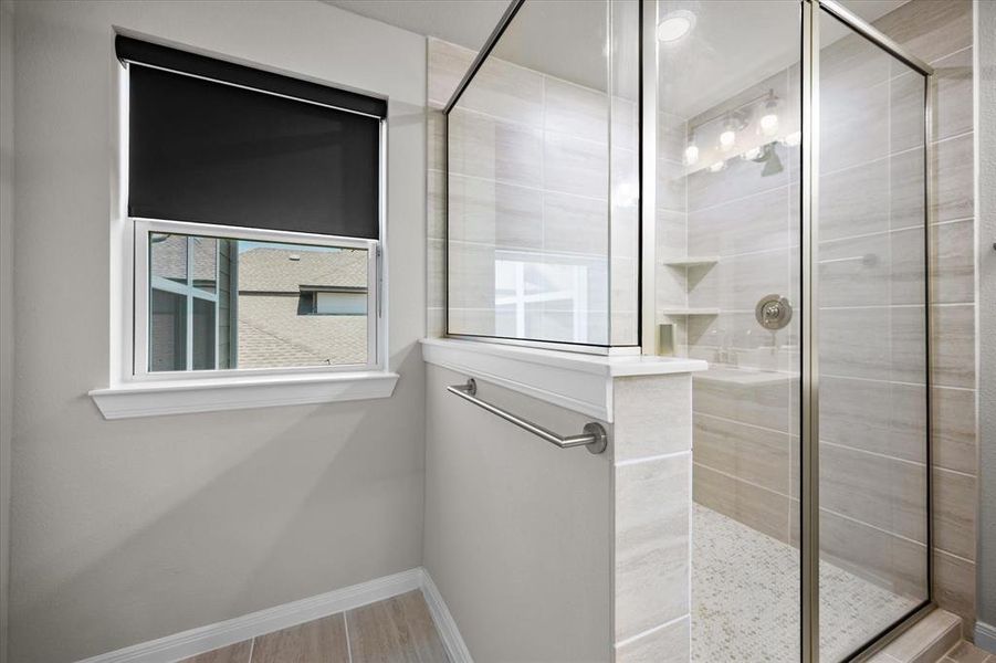 Full bath featuring a stall shower Full bath featuring a stall shower
