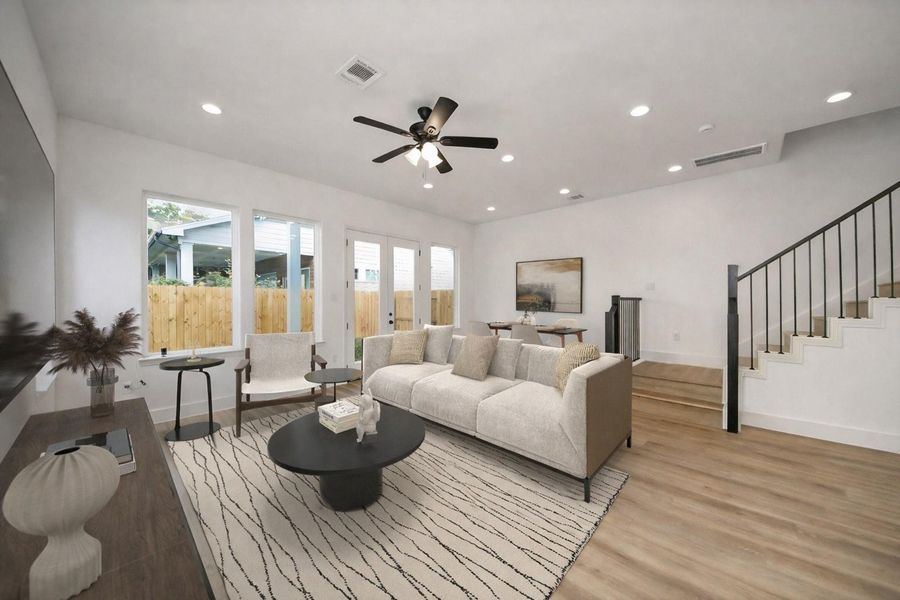 Spacious open-concept living with seamless flow to dining and kitchen areas. Bright, modern design ideal for both everyday living and entertaining.