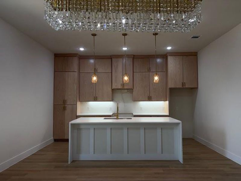 Emphasizing the under lights underneath the cabinets.
