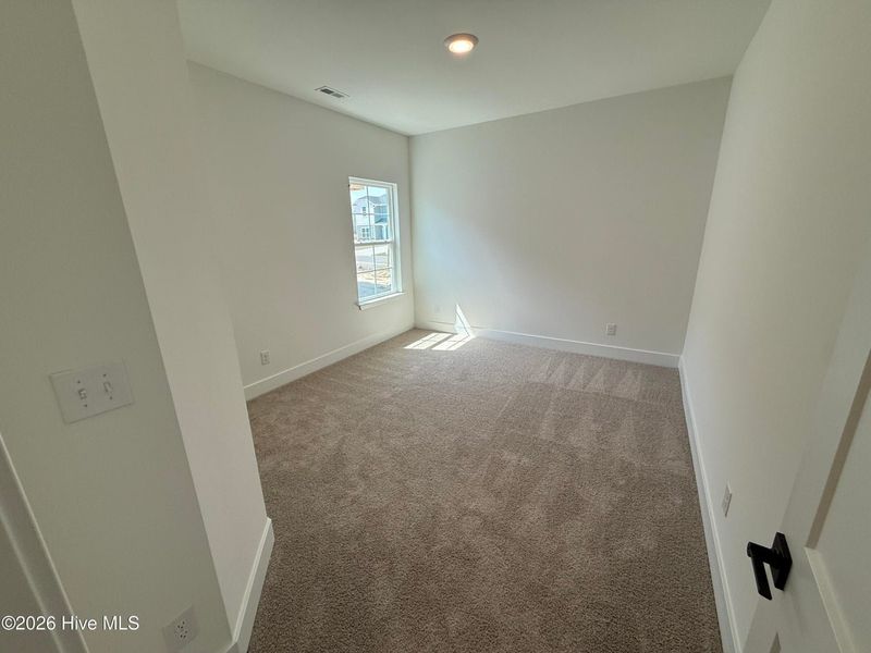 Spacious, unfurnished interior of a new home in Wood Creek Landing, Leland (Image 27).