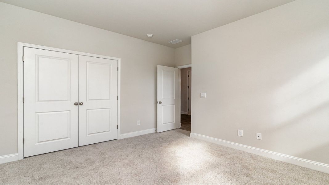 Representative unfurnished interior of a home built from the EATON by D.R. Horton in Eden Springs, Longs (Image 11).
