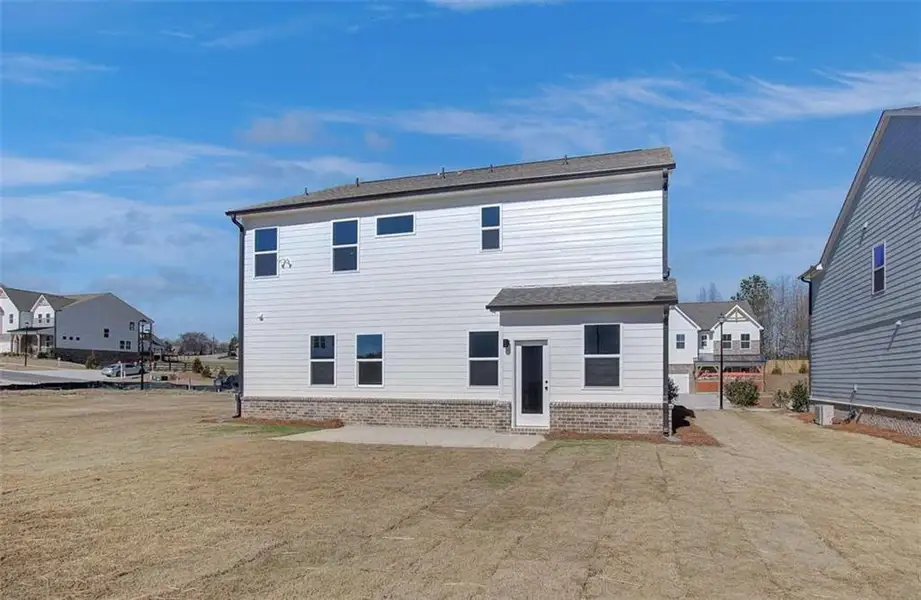 Exterior details and patio area of a home in The Paddocks at Doc Hughes, Buford (Image 3).