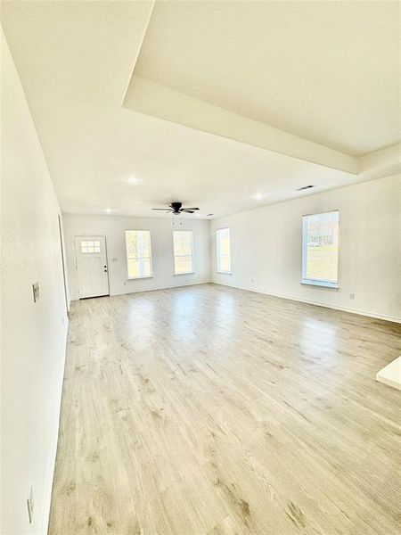 Empty room featuring light wood-style flooring, recessed lighting, and ceiling fan