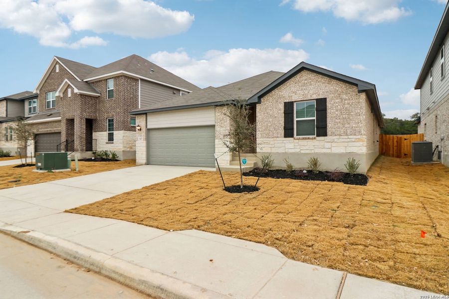 Front exterior of a new home in Sagebrooke - Classic Series, San Antonio, TX, highlighting curb appeal (Image 21).