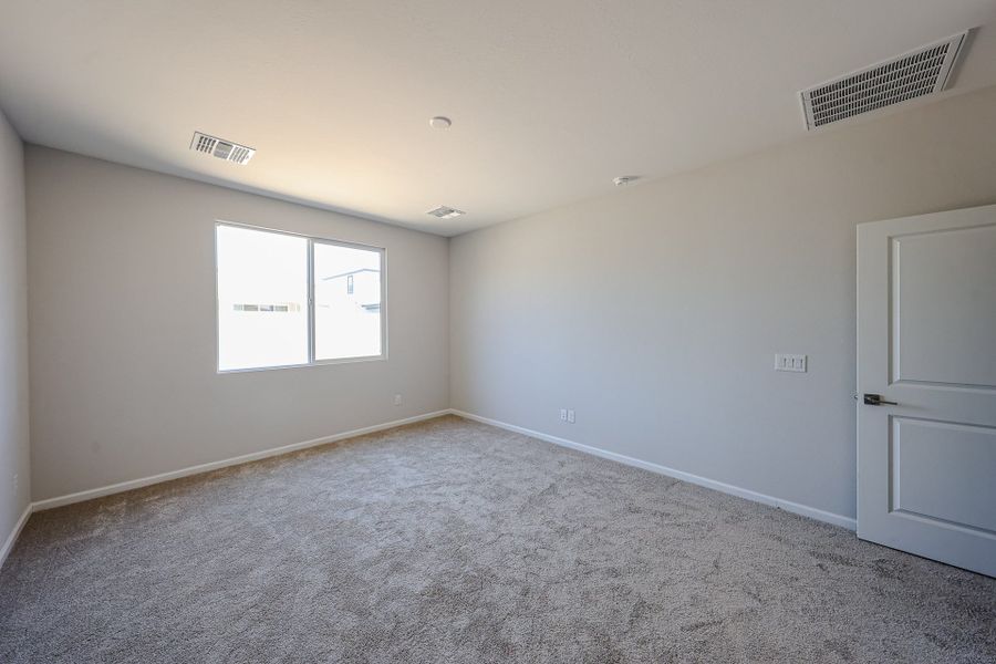 A room with white walls and a window. A room with white walls and a window.