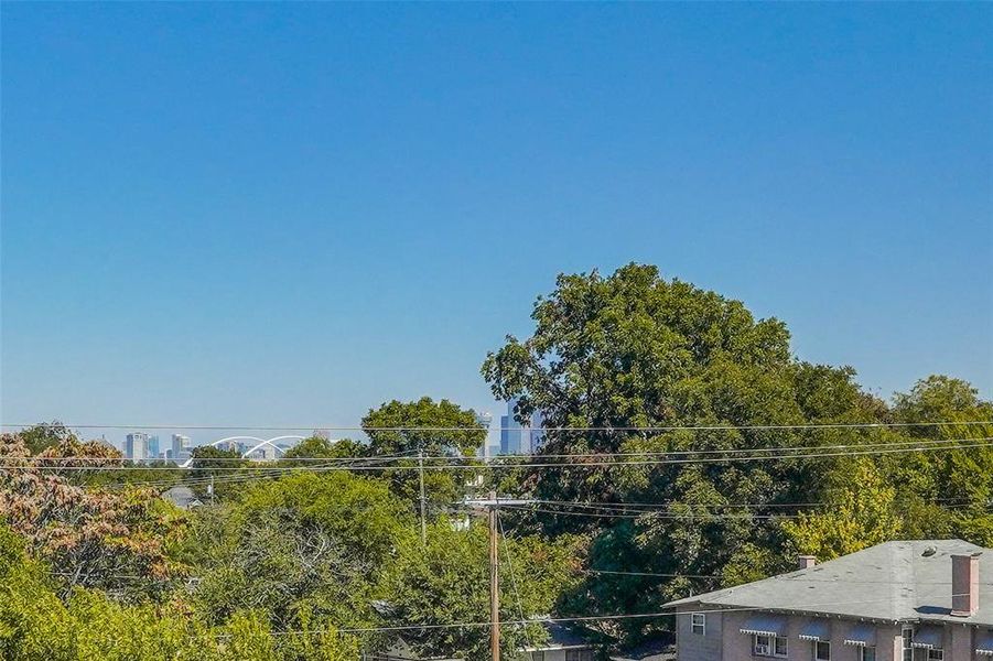 Model Rooftop Deck featuring view of scattered trees