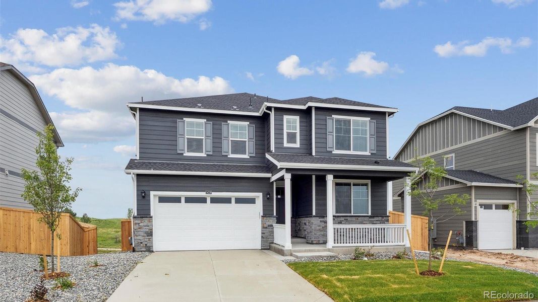 Front exterior of a new home in Brighton Crossing, Brighton, CO, highlighting curb appeal (Image 1). Front exterior of a new home in Brighton Crossing, Brighton, CO, highlighting curb appeal (Image 1).