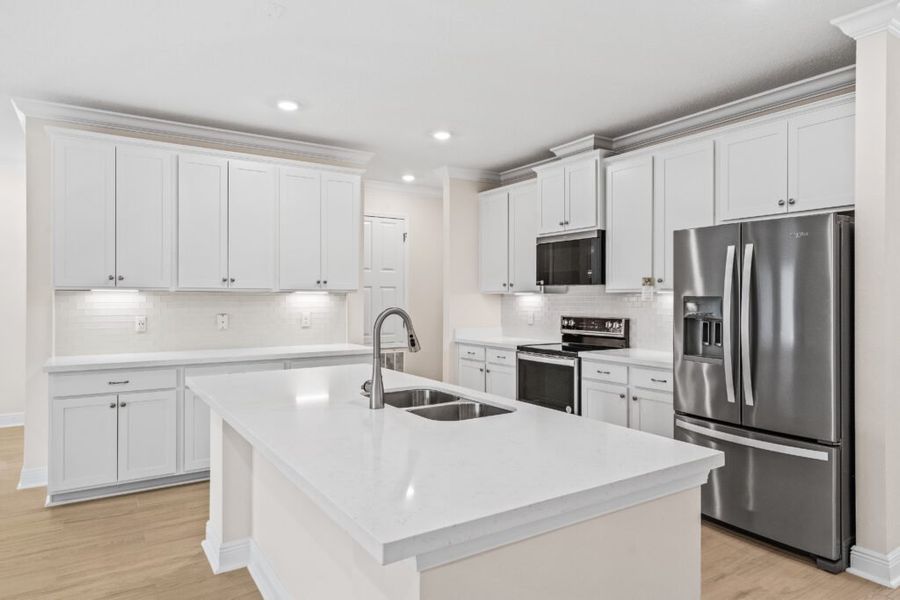Furnished interior view inside a new home in Windswept Estates, Freeport (Image 6).