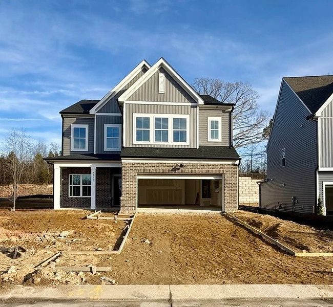 Exterior  - Earthy textures and warm tones feel rooted in place.