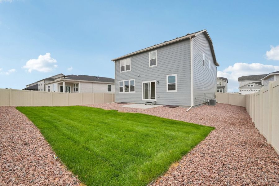 Exterior details and patio area of a home in The Trails at Aspen Ridge, Colorado Springs (Image 27).