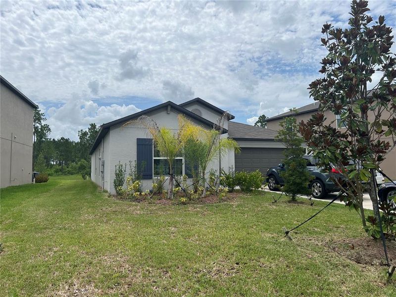 Front exterior of a new home in North Park Isle, Plant City, FL, highlighting curb appeal (Image 20).
