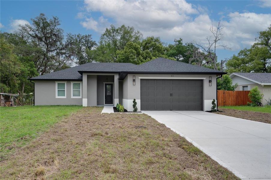 Front exterior of a new home in , Debary, FL, highlighting curb appeal (Image 2). Front exterior of a new home in , Debary, FL, highlighting curb appeal (Image 2).