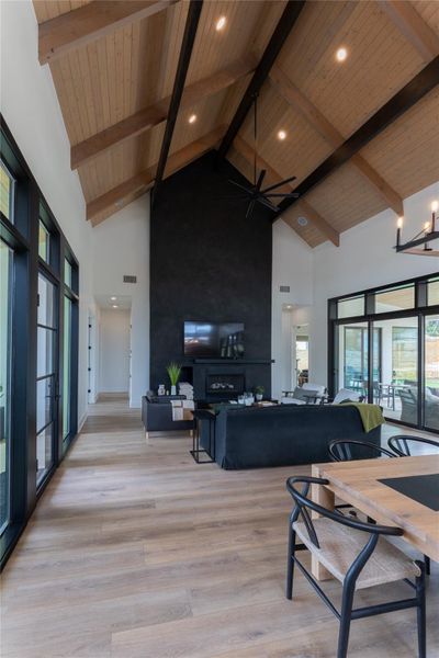 Soaring vaulted ceilings with exposed wood beams and recessed lighting Soaring vaulted ceilings with exposed wood beams and recessed lighting