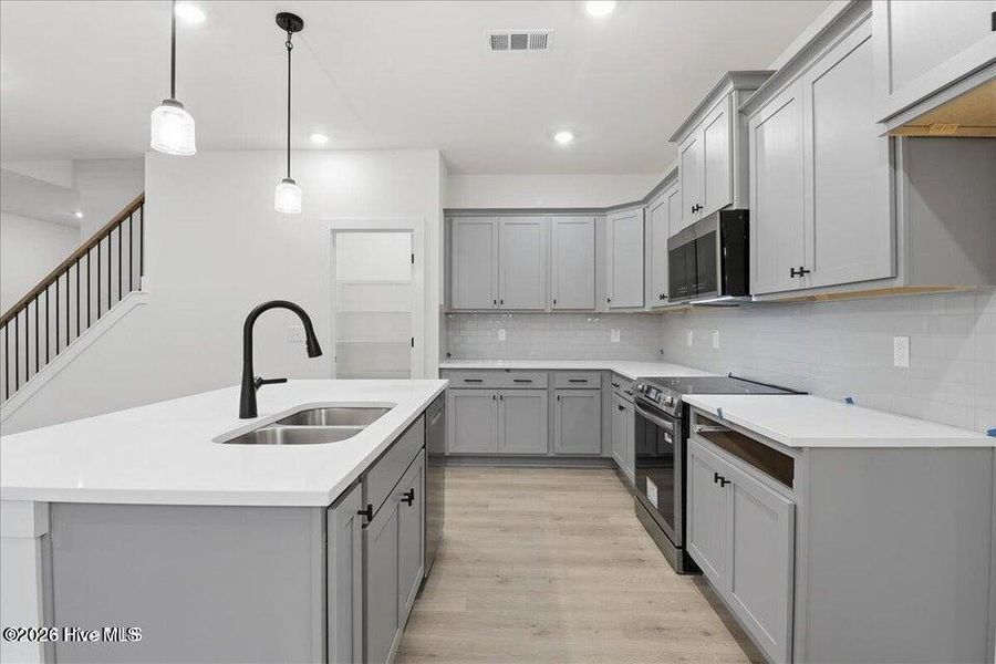 Furnished interior view inside a new home in Wood Creek Landing, Leland (Image 8).