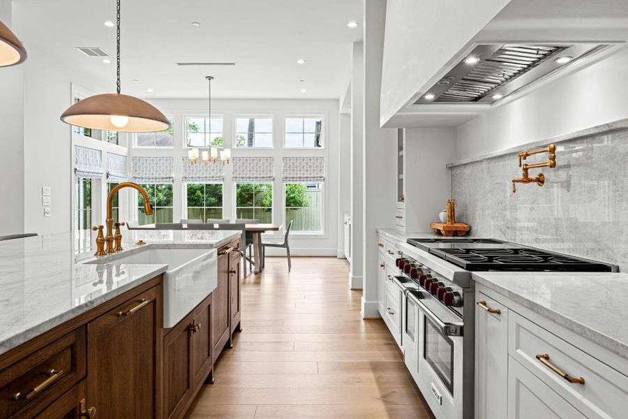 A full suite of premium appliances includes a panel-front Sub-Zero refrigerator & freezer, 48” Wolf gas range w/ double convection ovens, griddle & an oversized plaster vent hood above. Wolf stainless steel built-in microwave drawer. A A Bosch panel front dishwasher is located in the island. A full suite of premium appliances includes a panel-front Sub-Zero refrigerator & freezer, 48” Wolf gas range w/ double convection ovens, griddle & an oversized plaster vent hood above. Wolf stainless steel built-in microwave drawer. A A Bosch panel front dishwasher is located in the island.
