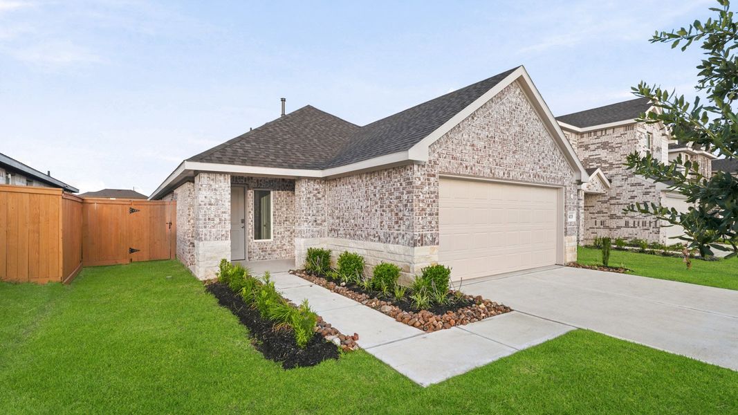 Front exterior of a new home in Sunterra, Katy, TX, highlighting curb appeal (Image 18).