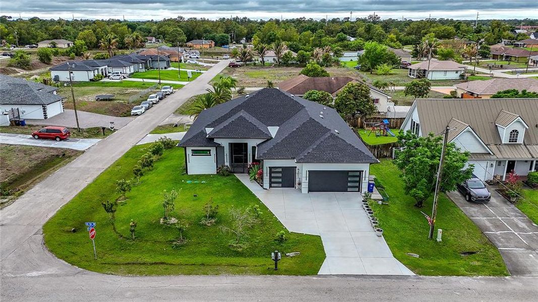 Front exterior of a new home in , Lehigh Acres, FL, highlighting curb appeal (Image 31).