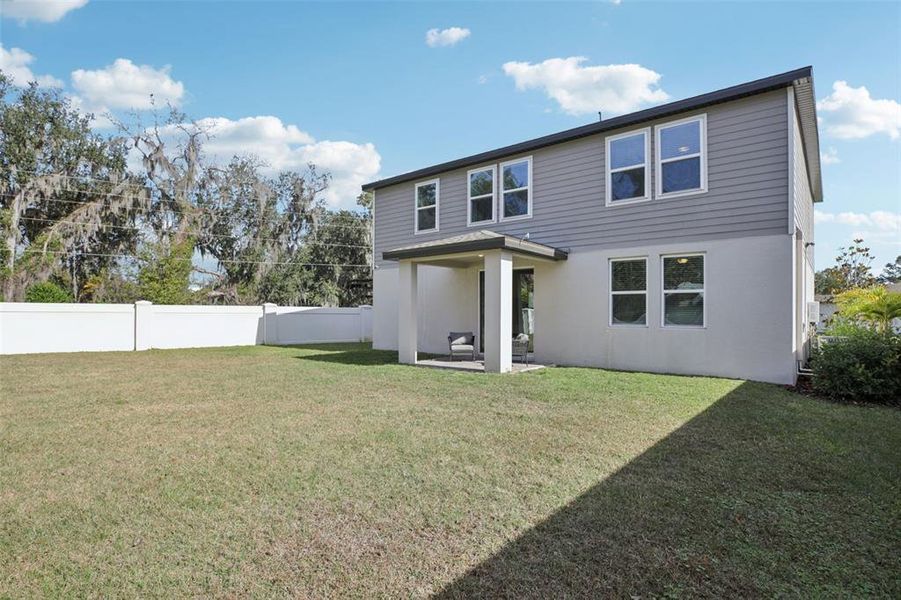 Exterior details and patio area of a home in Fox Pointe at Rivers Edge, Leesburg (Image 27).