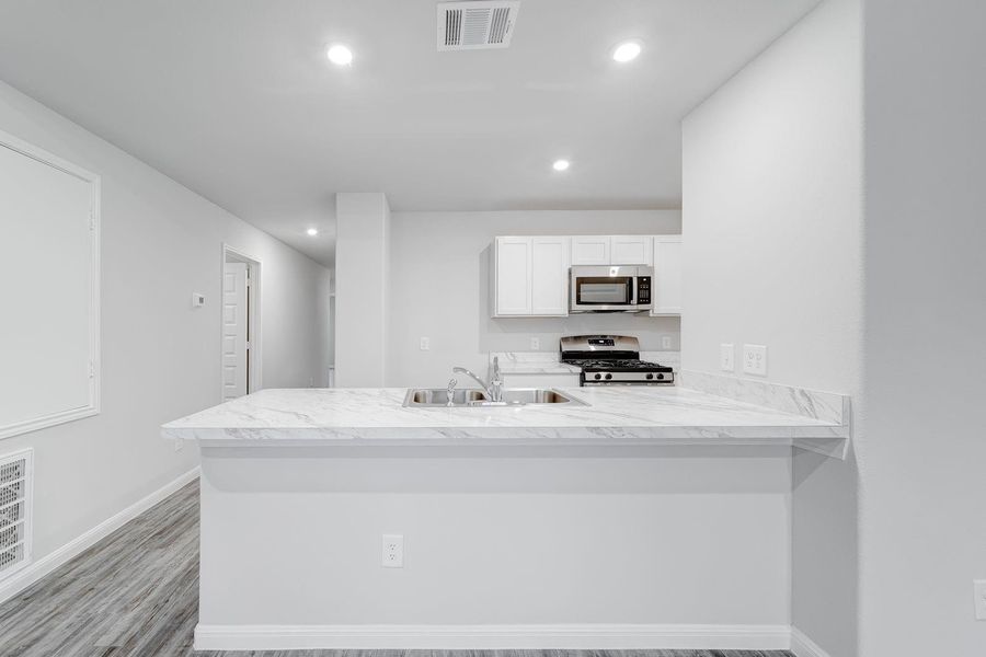 Furnished interior view inside a new home in Pirate's Cove Estates, Vidor (Image 6).