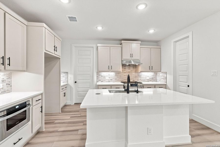 Furnished interior view inside a new home in Crown Ridge Manor, San Antonio (Image 8).