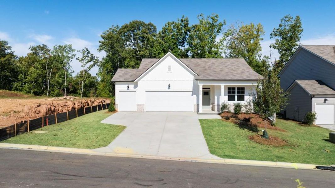 Front exterior of a new home in Falcon Landing, Gainesville, GA, highlighting curb appeal (Image 1).
