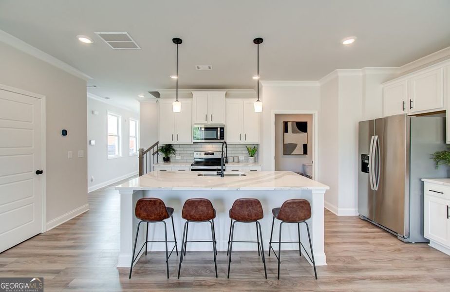 Furnished interior view inside a new home in The Towns at Auburn Station West, Auburn (Image 6).