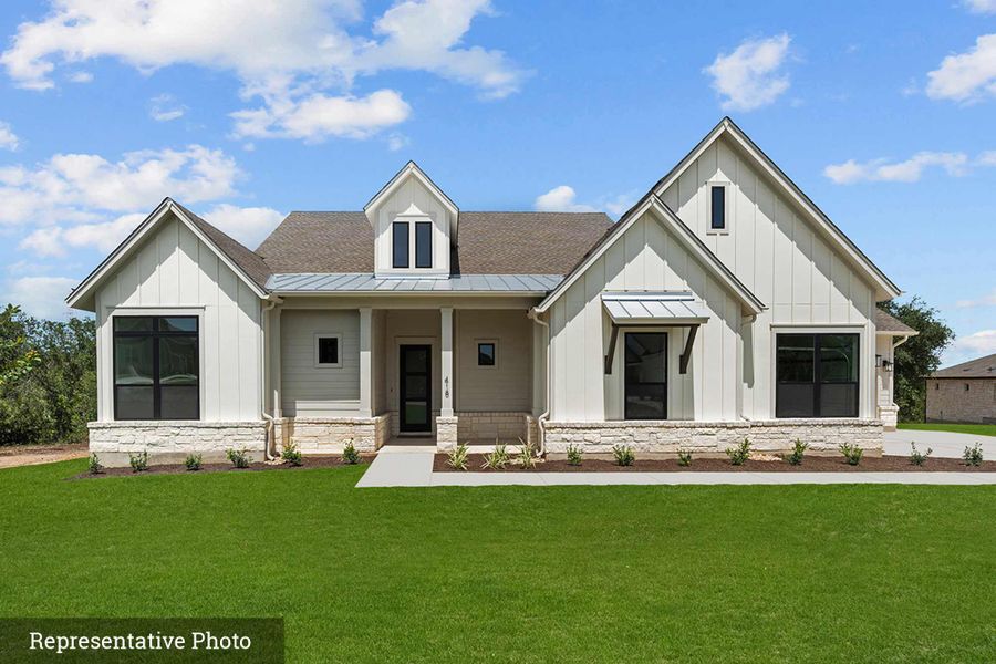 Front exterior of a new home in Rees Landing Estates, Spicewood, TX, highlighting curb appeal (Image 25). Front exterior of a new home in Rees Landing Estates, Spicewood, TX, highlighting curb appeal (Image 25).