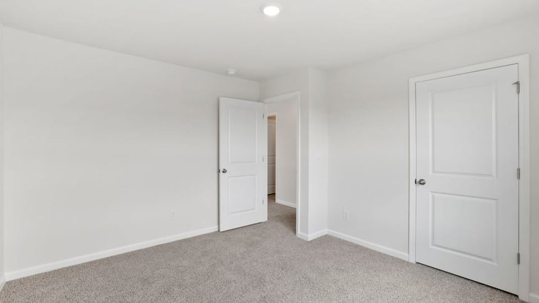 Spacious, unfurnished interior of a new home in Durbin Meadows Traditions, Fountain Inn (Image 32).