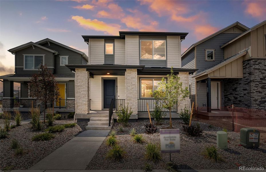 Front exterior of a new home in Painted Prairie, Aurora, CO, highlighting curb appeal (Image 14).