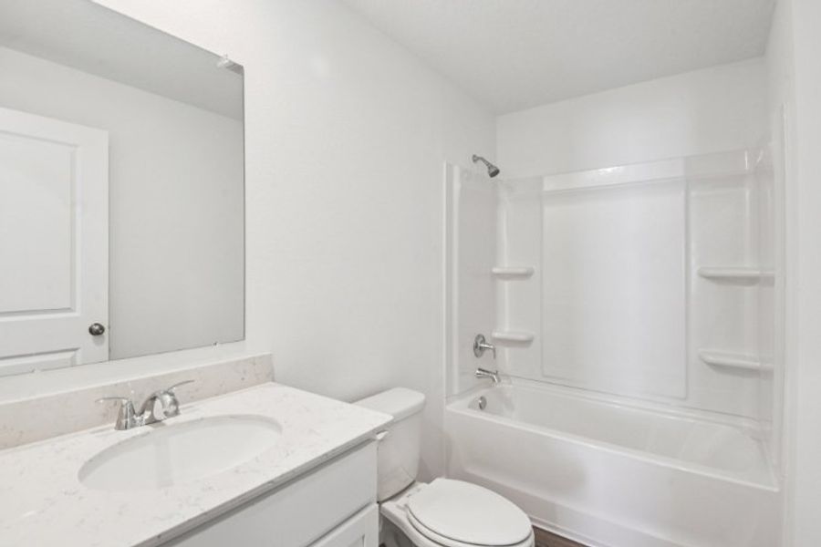 A bathroom with a sink and a toilet.