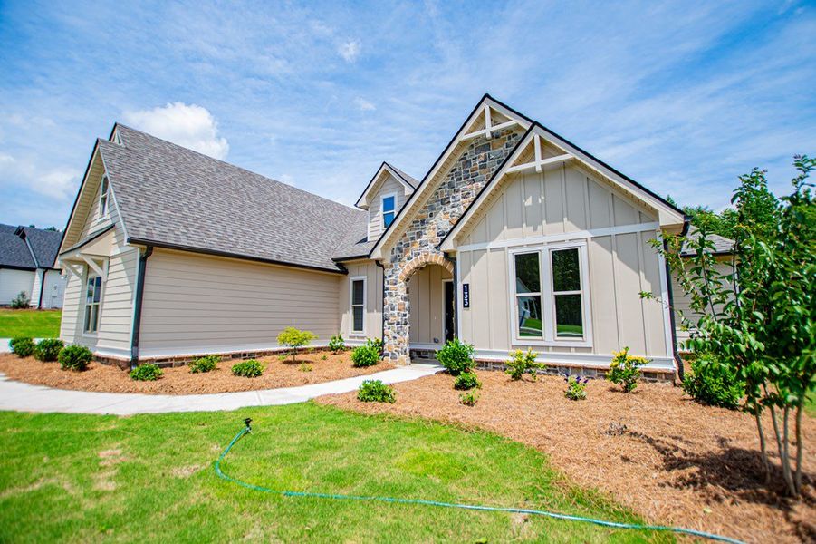 Front exterior of a new home in WOODMONT RESERVE, Roopville, GA, highlighting curb appeal (Image 32).