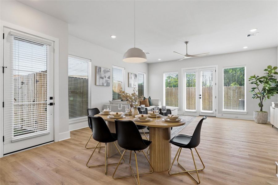 An expansive open-concept living and dining area defined by 10-foot ceilings and uninterrupted sightlines, creating a sense of scale and openness throughout. An expansive open-concept living and dining area defined by 10-foot ceilings and uninterrupted sightlines, creating a sense of scale and openness throughout.