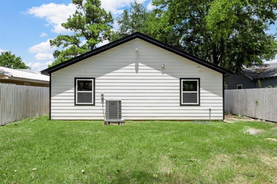 View of side of home with a fenced backyard View of side of home with a fenced backyard