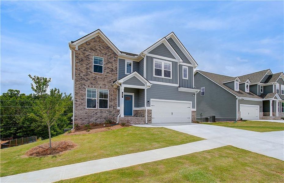Front exterior of a new home in Chapel Hill, Newnan, GA, highlighting curb appeal (Image 13). Front exterior of a new home in Chapel Hill, Newnan, GA, highlighting curb appeal (Image 13).