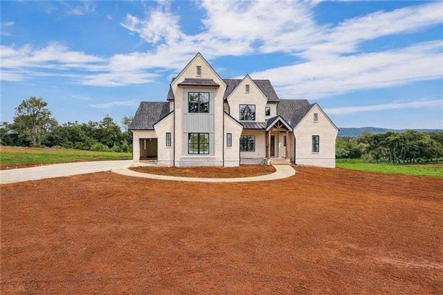 Front exterior of a new home in , Rydal, GA, highlighting curb appeal (Image 1). Front exterior of a new home in , Rydal, GA, highlighting curb appeal (Image 1).