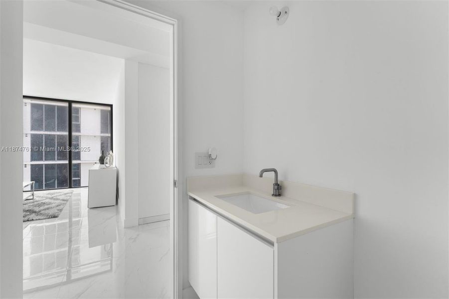 Furnished interior view inside a new home in Aria Reserve, Miami (Image 1).